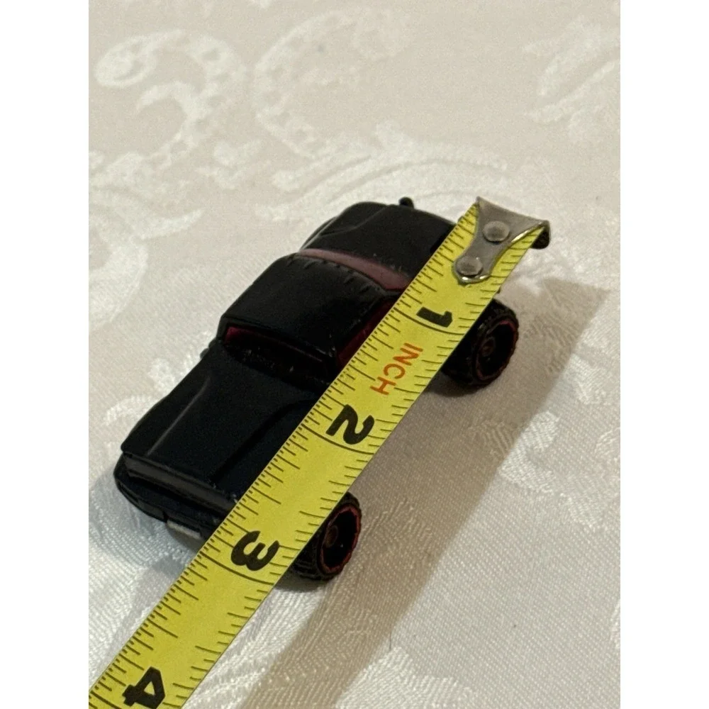Hot Wheels Mega Duty black pickup truck, specifically the 2010 Heat Fleet